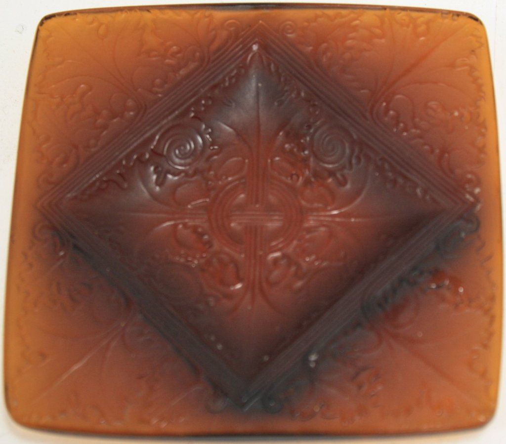 RENE LALIQUE DEEP AMBER GLASS VEZELAY ASHTRAY,: CA 1924, SIGNED TWICE, ETCHED ON BOTTOM AND EMBOSSED ON TOP R. LALIQUE, FRANCE K1 281. 4 1/2" X 4 1/2".