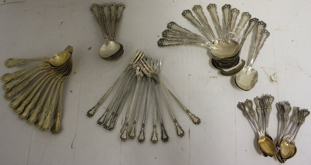 53 PIECE STERLING SILVER LOT TO INCLUDE 12 FANCY: 5 1/4" WHITING SPOONS, 6 BOUILLON SPOONS 5" BY GORHAM, 12 DEMITASSE SPOONS 3 3/4", 11 GRAPEFRUIT SPOONS 5 1/2" BY GORHAM AND 12 OYSTER FORKS 5 1/2" BY GORHAM. 28 TROY OZ.