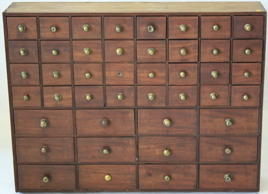 EARLY 19TH C APOTHECARY CHEST, MAHOGANY WITH PINE: SECONDARY WOOD. ENDS REPLACED, 1 PULL MISSING, MINOR CHIPPING ON 1 DRAWER CORNER. 32 3/4" HIGH, 42 3/4" WIDE, 8 1/2" DEEP.