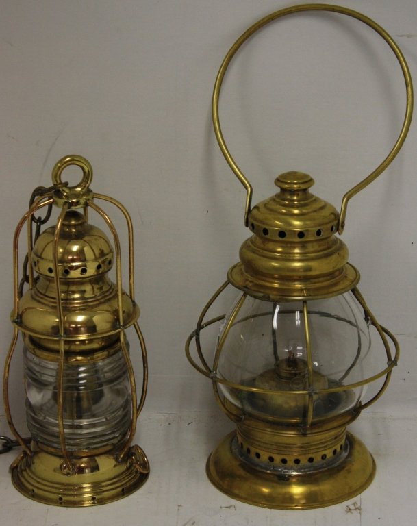 2 BRASS LANTERNS TO INCLUDE A PEAR SHAPED CLEAR: LAMP WITH SWING HANDLE, 10 1/2" HIGH, BURNER MARKED E. MILLER & CO, ALONG WITH A SMALL ANCHOR LIGHT, 11" HIGH.