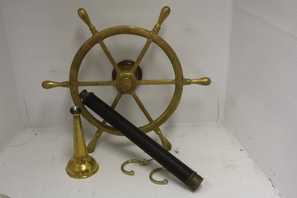 4 PIECE NAUTICAL LOT TO INCLUDE BRASS SHIPS WHEEL: 20" DIAMETER, A BRASS SPEAKING TRUMPET, 8" LONG, A TELESCOPE 25" LONG OPEN, 18" CLOSED. ORIGINAL THREAD ON BARREL. INCLINOMETER, 8" X 10" (NOT IN PHOTO).