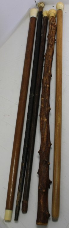 FIVE 19TH C SCRIMSHAW CANES WITH WOODEN SHAFTS: AND CARVED WHALEBONE HANDLES. 32" TO 36" LONG. FROM IPPOLITO COLLECTION.