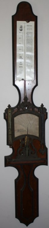19TH C STICK BAROMETER , N. M. LOWE, EDSON'S: HYGRODEIK, SQUARED BANJO FORM WITH GOTHIC TRIM. COMBINATION BAROMETER AND THERMOMETER. THERMOMETER BROKEN (NO MERCURY). 42" LONG. THE PAPER DIRECTIONS LABEL IS A REPRODUCTION OF THE ORIGINAL.