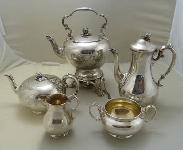 Five Piece Sterling Silver Tea Set: Total weight on set 81.5 ozt; Kettle 36.8 ozt, Coffee Pot 18.1 ozt, Tea pot 15.4 ozt, Cream and Sugar together 11.2 ozt