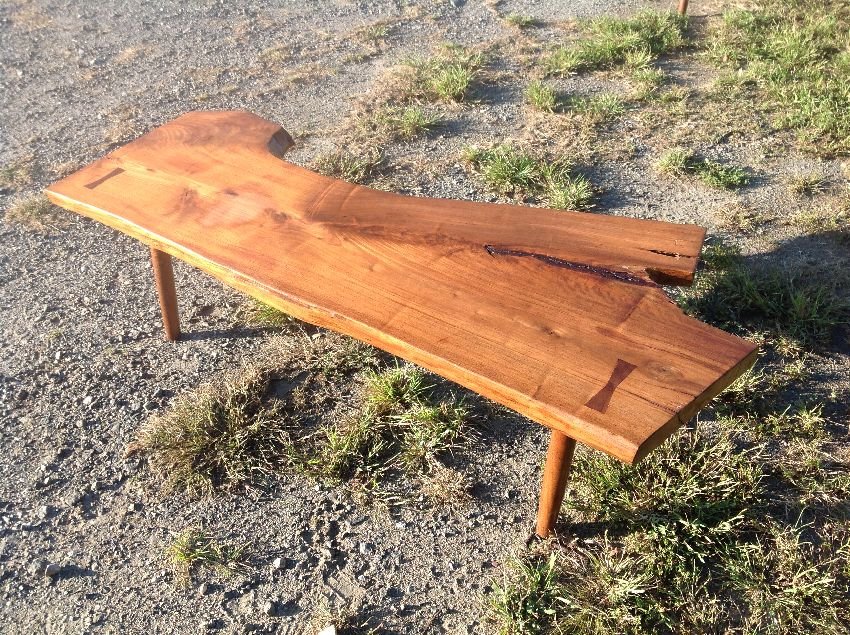 Free form Butterfly Dove tail Walnut Plank Coffee table: Nakashima style free form plank walnut coffee table with butterfly dove tail table top standing 17" high and measuring 57" long by 23" wide.