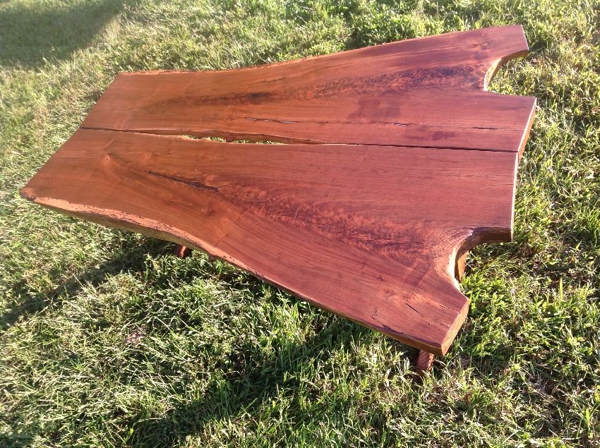 Nakshima style Free Form Plank Walnut Coffee table: Nakashima style free form walnut plank top coffee table that stands 17" high and is 46" long by 33" wide.