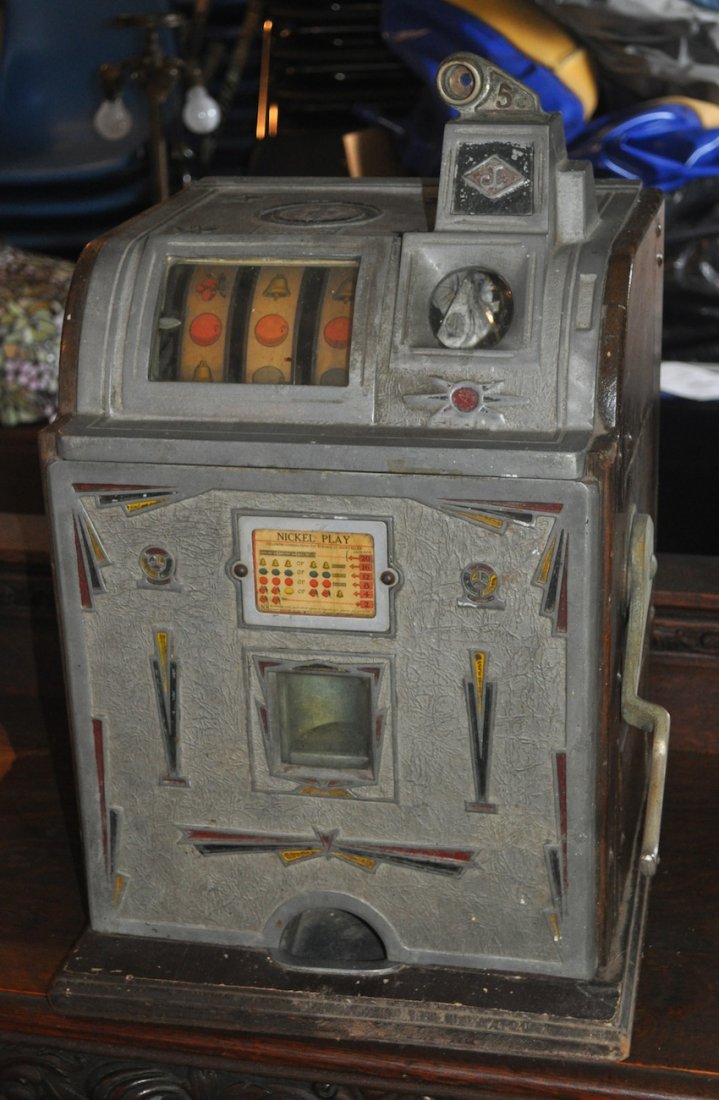 O.D. Jennings 5 Cent Oak Slot Machine, Circa 1950: O.D Jennings 5 cent oak slot machine, circa 1950; extends H 24' , D 15" x 15". Sold as is.