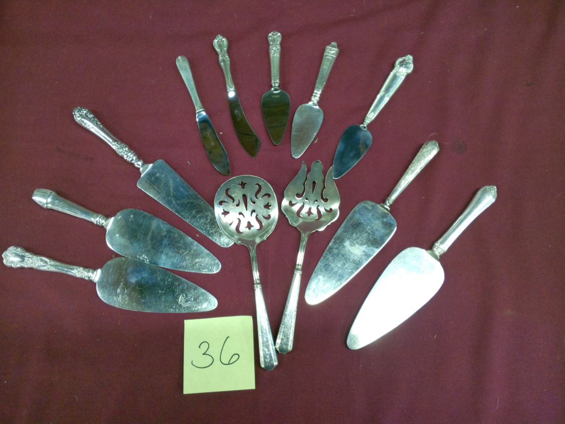 12 Assorted Sterling Silver Handled Pieces: Sterling silver handled serving utensils --6ozt