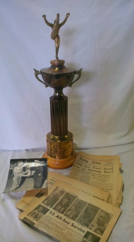 1955 Football Trophy & Photo Noel Schmidt Navy Guide: Navy Guide Trophy awarded to LTJG. Noel F Schmidt USNR Outstanding Player 1955 Red Feather Bowl, Norfolk, VA. -- bakelite base-- 26 1/2"h. Presentation photograph and newspaper clippings includedNoel