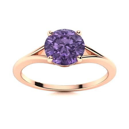 Natural 1.06 CTW Iolite Solitaire Ring 18K Rose Gold: Natural 1.06 CTW Iolite Solitaire Ring 18K Rose Gold Manufacturer's Suggested Retail Price: $1380.00 Center Stone: 1 Iolite @ 1.06 ctw Center Stone Color: Violet-blue Center Stone Clarity: AAAA Center