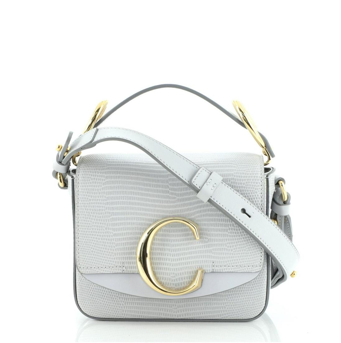 Chloe C Flap Bag Lizard Embossed Leather Mini: Chloe C Flap Bag Lizard Embossed Leather Mini Condition: Pre-owned - Great Minor darkening on rear and flap, small mark on rear, glue stains on opening corners. Slight creasing and light scuffs undern