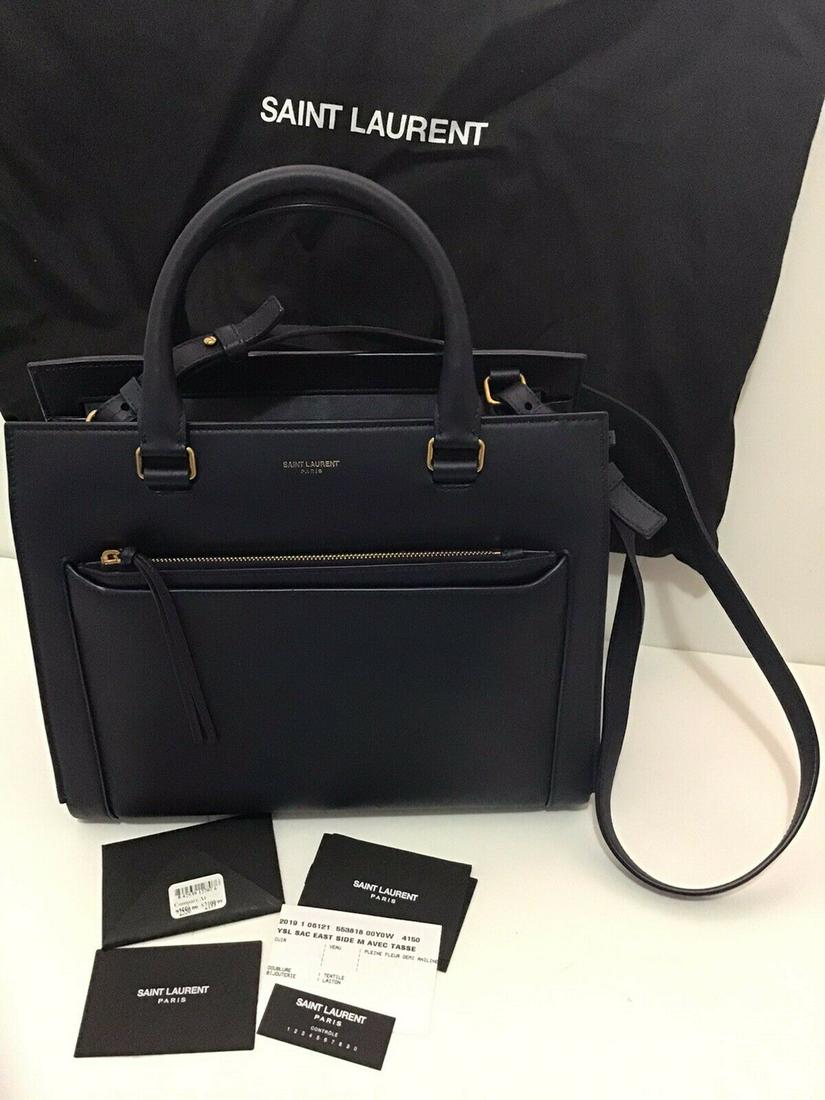 NWT Saint Laurent YSL Sac East Side Navy top Handle: NWT Saint Laurent YSL Sac East Side Navy top Handle Tote handbag New with defects: A brand-new, unused, and unworn item. Possible cosmetic imperfections range from natural color variations to scuffs,