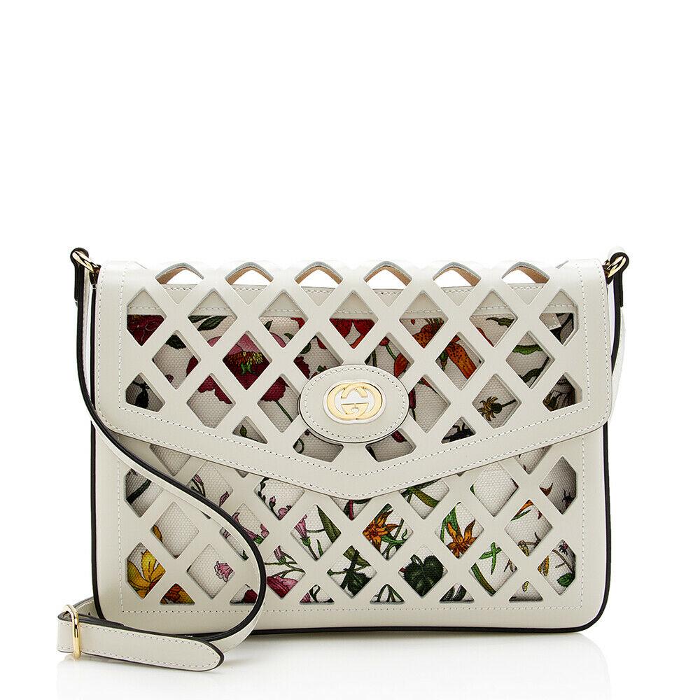 Gucci Cutout Leather Floral Shoulder Bag: Gucci Cutout Leather Floral Shoulder Bag Condition: Pre-owned: An item that has been used or worn previously. See the consignor's full listing description for more details. Seller Notes: “Minor warp