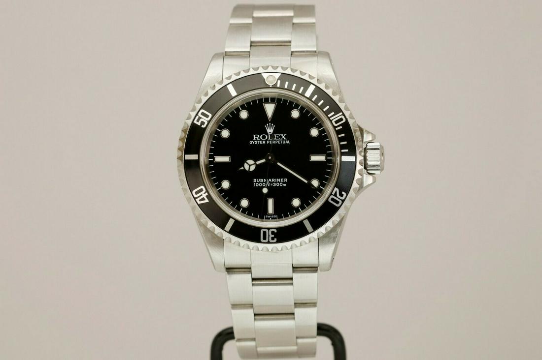 Rolex Submariner Automatic 40mm Dive Watch 14060 A: Rolex Submariner Automatic 40mm Dive Watch 14060 A Series “Swiss Only” Pre-owned: An item that has been used previously. The item may have some signs of cosmetic wear, but is fully operational and