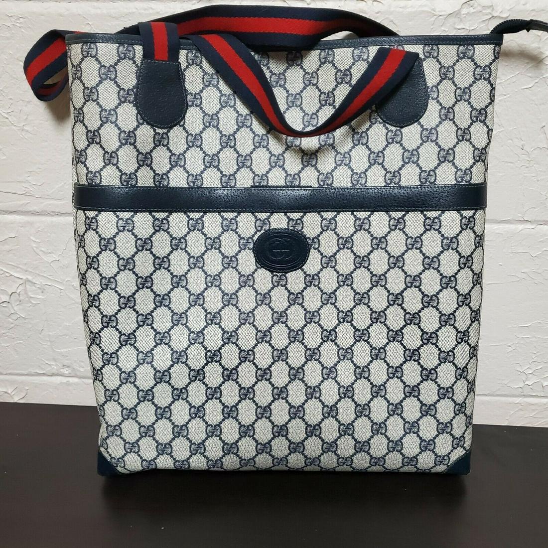 Pre-Owned Vintage Gucci Supreme Navy Monogram Coated: Pre-Owned Vintage Gucci Supreme Navy Monogram Coated Canvas Shopper Tote Pre-owned: An item that has been used or worn previously. See the consignor's listing for full details and description of any i