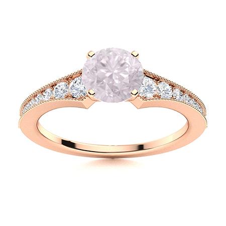 Natural 0.86 CTW Rose Quartz & Diamond Engagement Ring: Natural 0.86 CTW Rose Quartz & Diamond Engagement Ring 18K Rose Gold Manufacturer's Suggested Retail Price: $2580.00 Center Stone: 1 Rose Quartz @ 0.62 ctw Center Stone Color: Pink Center Stone Clarit
