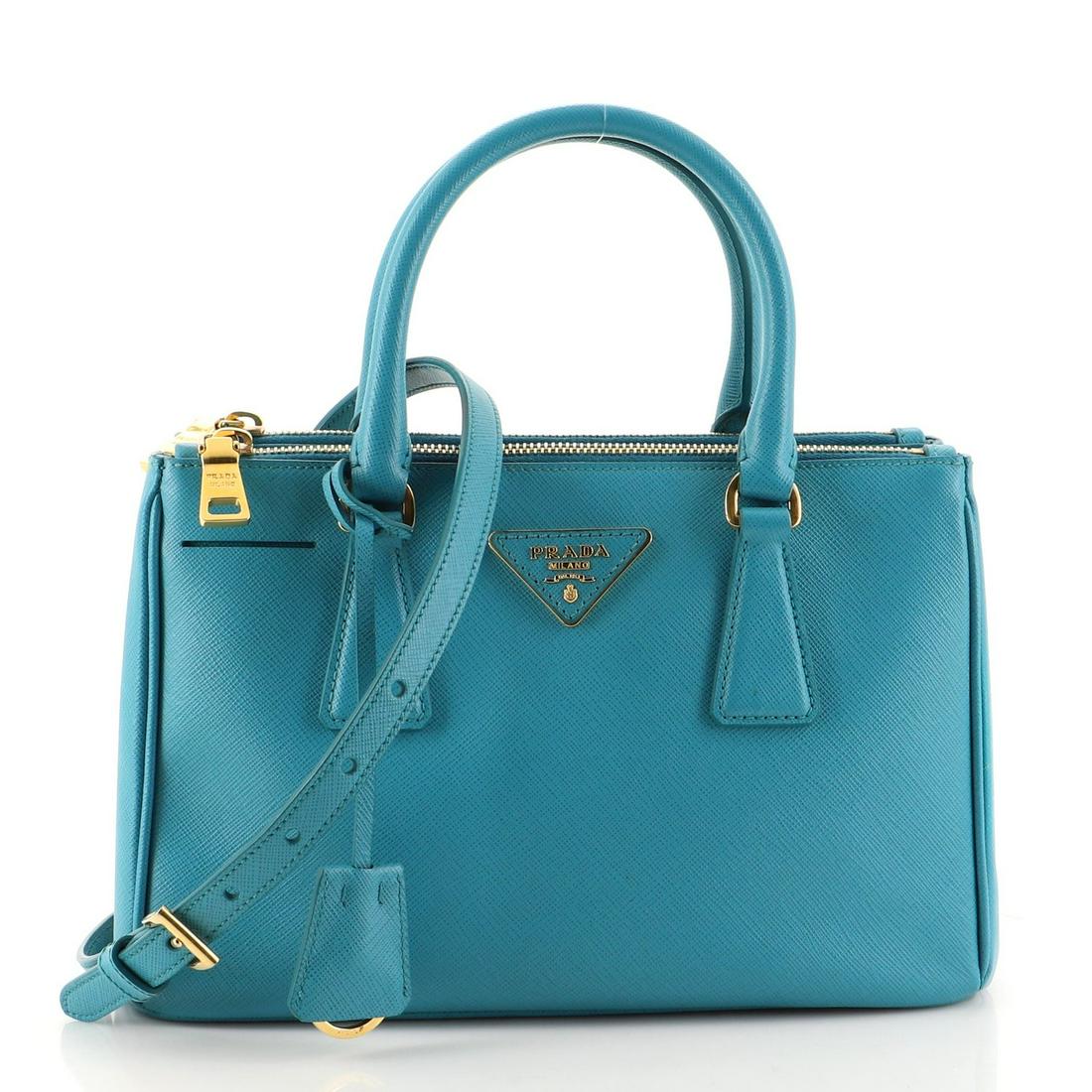 Prada - Galleria Double Zip Tote Saffiano Leather Small: Prada - Galleria Double Zip Tote Saffiano Leather Small Exterior Color: Blue Interior Color: Blue Exterior Material: Leather Interior Material: Fabric Hardware Color: Gold Accessories: Clochette,