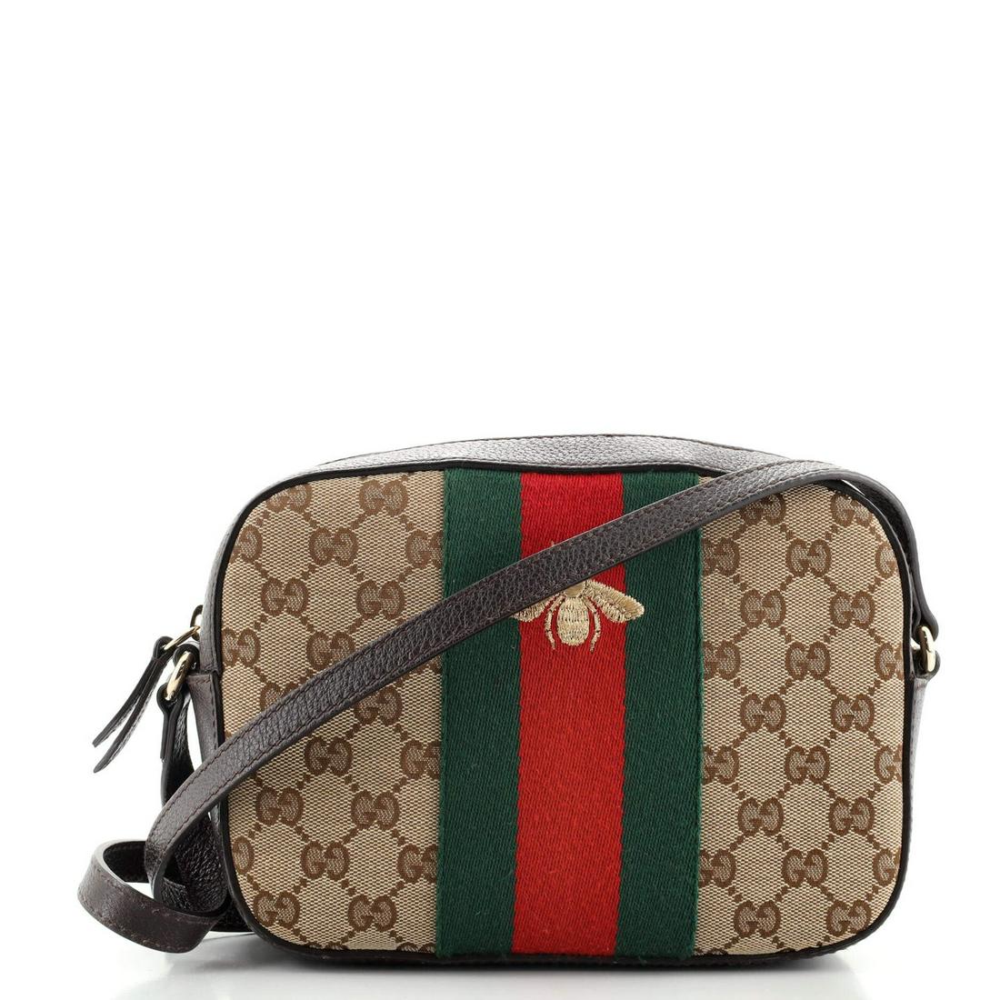 Gucci Bee Web Camera Bag GG Canvas: Gucci Bee Web Camera Bag GG Canvas Exterior Color: Brown Interior Color: Neutral Exterior Material: Canvas (Plain) Interior Material: Fabric Hardware Color: Gold Tone Accessories: No Accessories <br