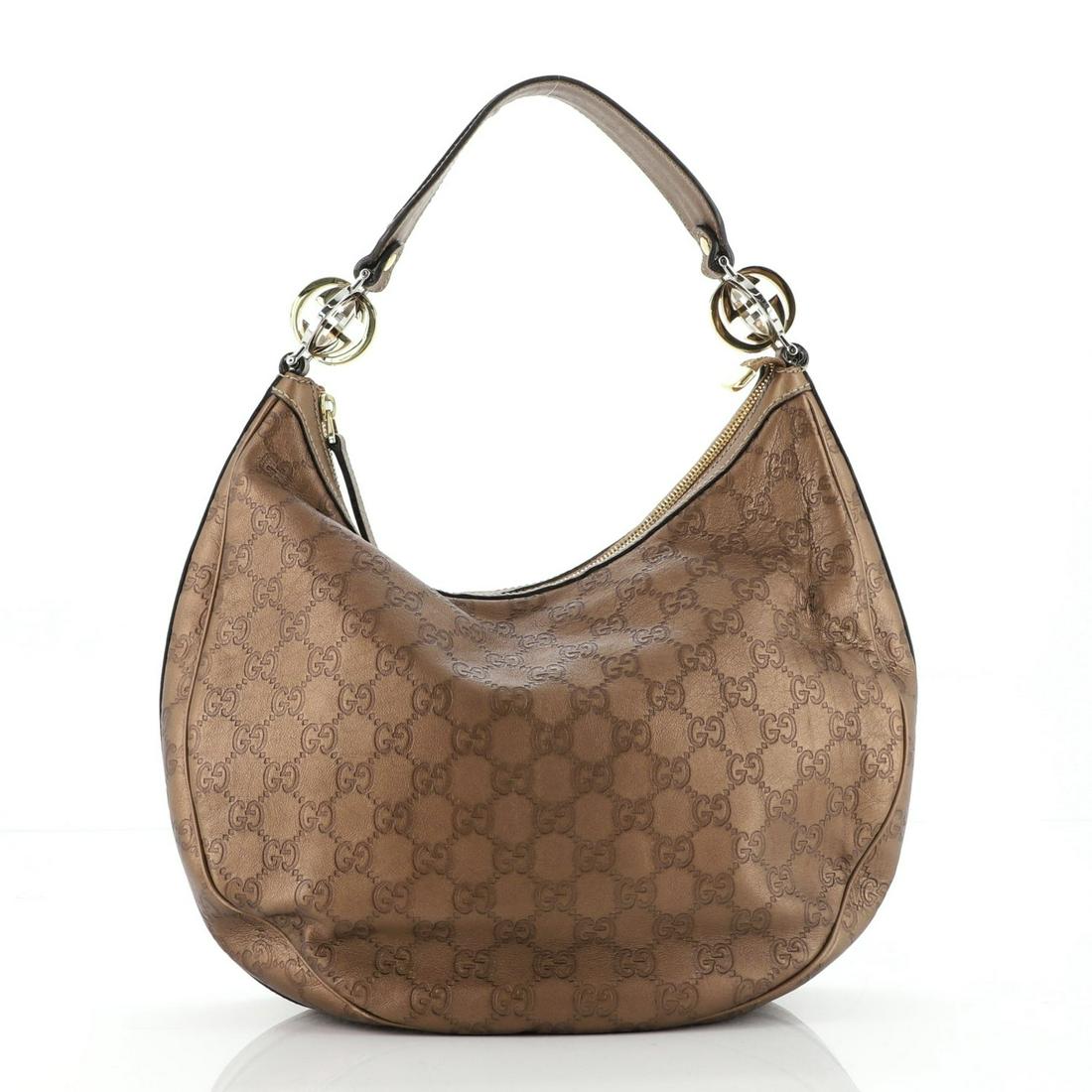 Gucci Twins Hobo Guccissima Leather Medium: Gucci Twins Hobo Guccissima Leather Medium Brand: Gucci Exterior Color: Brown, Metallic Interior Color: Brown Exterior Material: Leather Interior Material: Fabric Hardware Color: Gold, Silver Acces