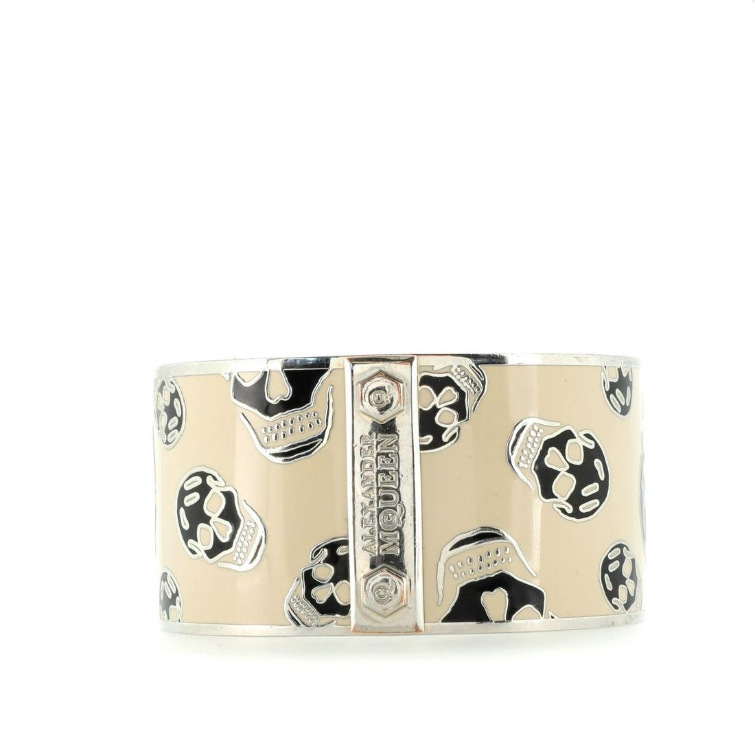 Alexander McQueen Skull Bangle Bracelet Metal and Enamel Wide: Alexander McQueen Skull Bangle Bracelet Metal and Enamel Wide Item No: 129978/1 SIZE AND FIT: Circumference: 8 ", Width: 1.5 " Exterior Color: Print Store Location: Online Only Material: Enamel, Metal