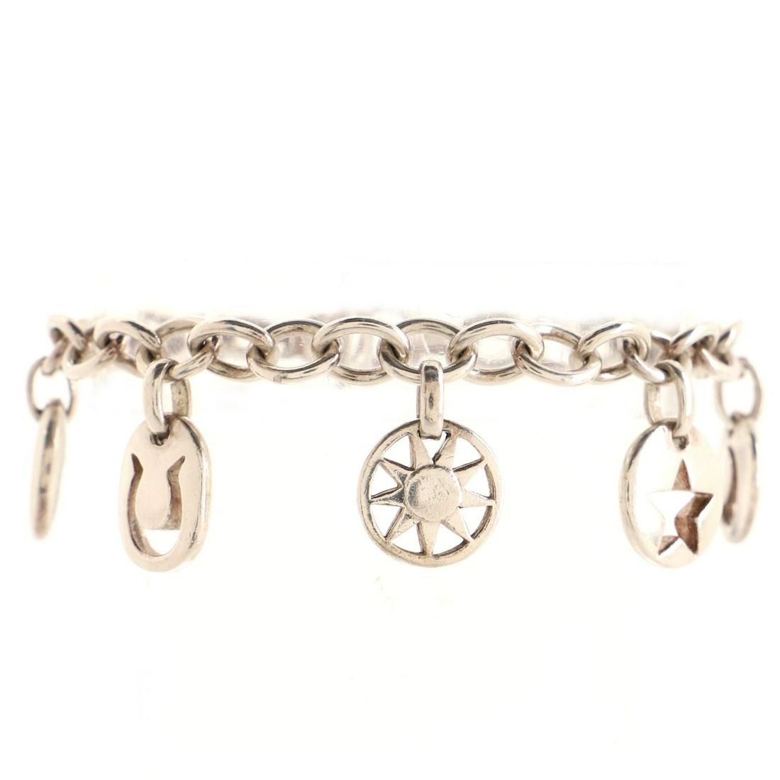 Tiffany & Co. Stencil Charms Bracelet Sterling Silver: Tiffany & Co. Stencil Charms Bracelet Sterling Silver Exterior Color: Silver Store Location: Online Only Material: Sterling Silver CLAIR CODE: BT.TCO.SNHT.SILV Item No: 107058/2 SIZE AND FIT: Circ