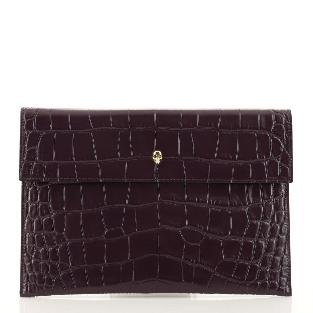 Alexander McQueen Skull Envelope Clutch Crocodile Embossed Leather: Alexander McQueen Skull Envelope Clutch Crocodile Embossed Leather Exterior Color: Purple Interior Color: Black Exterior Material: Leather Interior Material: Leather Hardware Color: Gold Accessori
