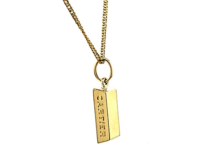 Cartier 18 Kt Yellow Gold 1/4 Ounce Bar Pendant: Cartier 18 Kt Yellow Gold 1/4 Ounce Bar Pendant Product Code: sf785_6659200385127 Brand: Cartier Condition: Never Worn Details: 18 kt Yellow Gold Total Weight: 7.9 grams Length: 0.75 inch Pendant only