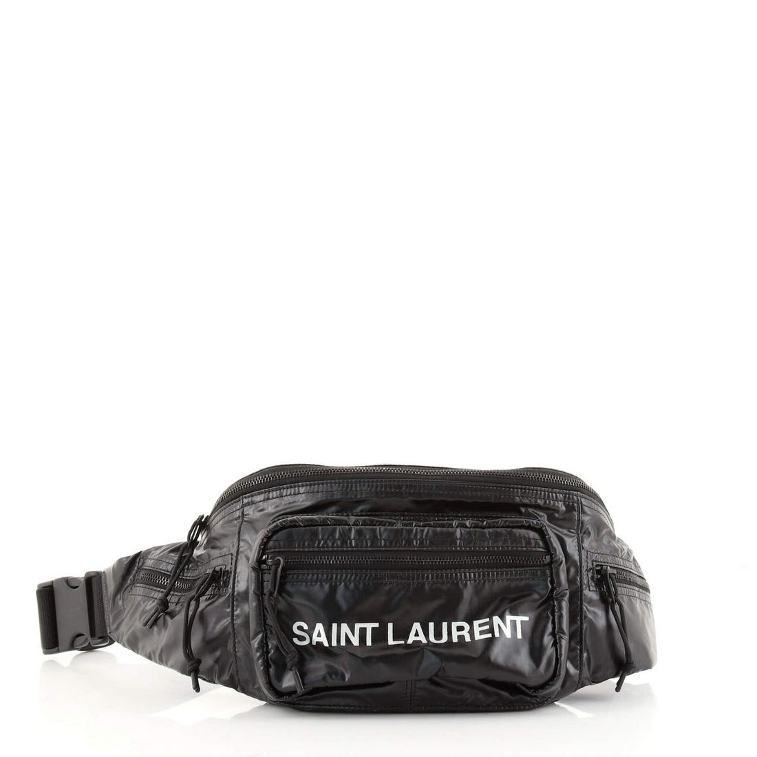 Saint Laurent Nuxx Waist Bag Nylon: Saint Laurent Nuxx Waist Bag Nylon RBJ CODE: HB.SL.NUXE.NY Item No: 137882/35 Brand Code: GAB.581375.0419 SIZE AND FIT: 10"W x 6.5"H x 3.5"D, 14-21" strap drop Exterior Color: Black Interior Color