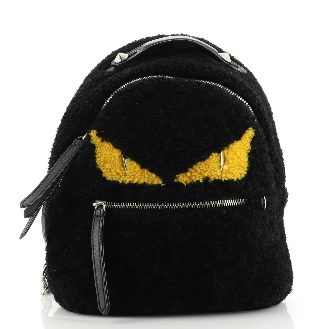 Fendi Monster Backpack Shearling Mini: Fendi Monster Backpack Shearling Mini Exterior Color: Black Interior Color: Black Exterior Material: Shearling Interior Material: Fabric Hardware Color: Silver Accessories: No accessories