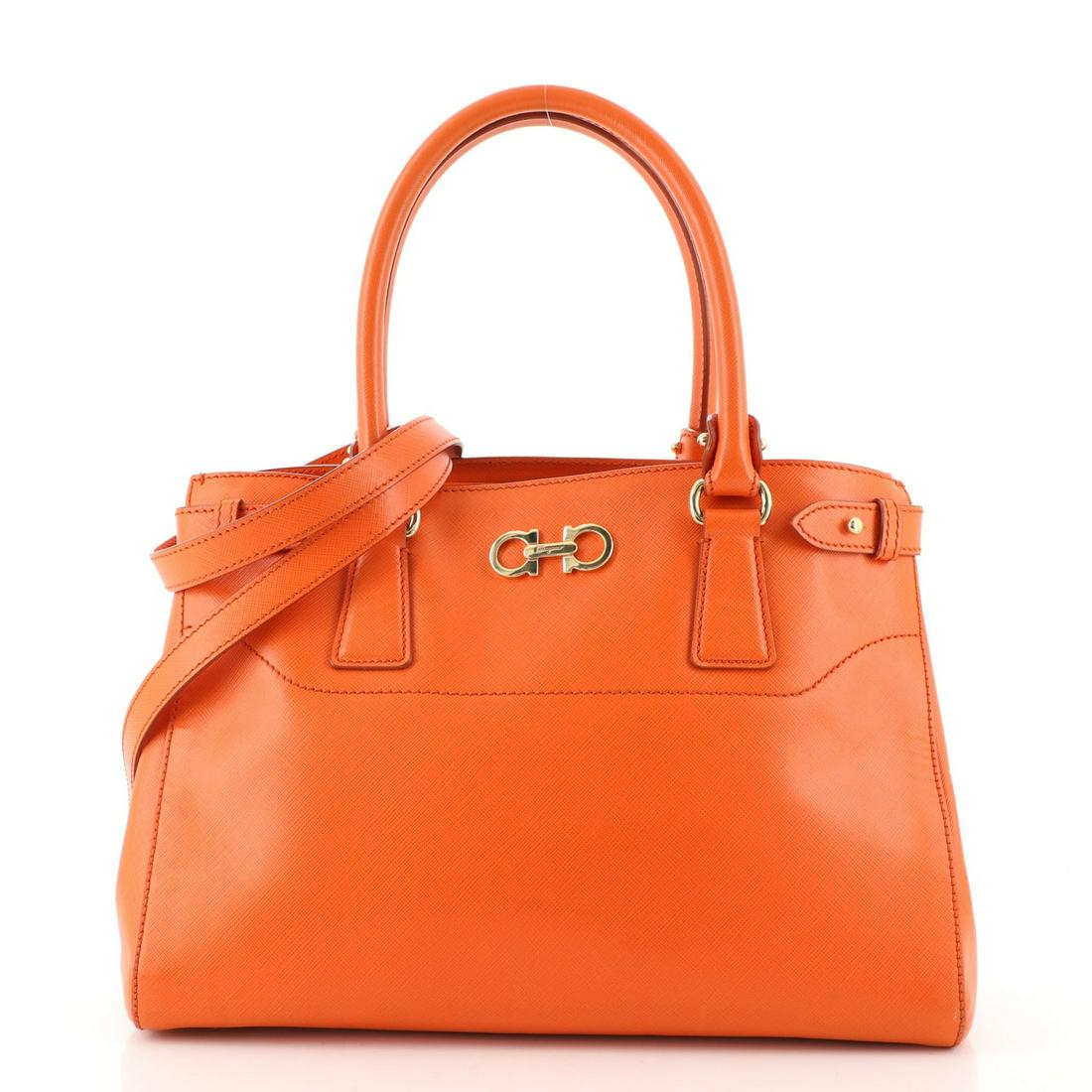 Salvatore Ferragamo Beky Tote Saffiano Leather Medium: Salvatore Ferragamo Beky Tote Saffiano Leather Medium Exterior Color: Orange Interior Color: Brown Exterior Material: Leather Interior Material: Fabric Hardware Color: Gold Accessories: Dust bag,
