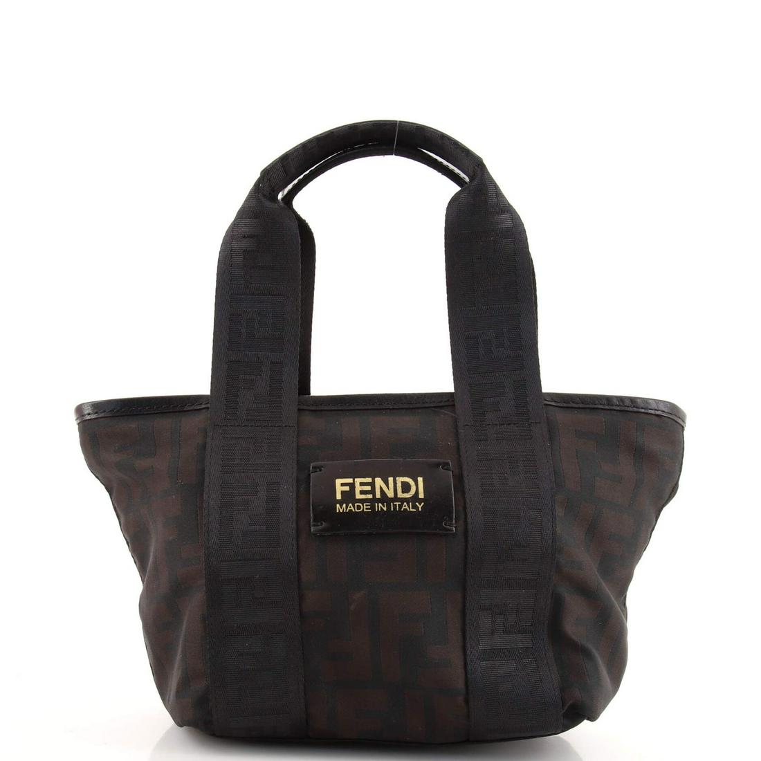 Logo Open Tote Zucca Nylon Mini Fendi: Logo Open Tote Zucca Nylon Mini Fendi Exterior Color: Brown Interior Color: Black Exterior Material: Nylon Interior Material: Fabric Hardware Color: Gold Accessories: No accessories RBJ n