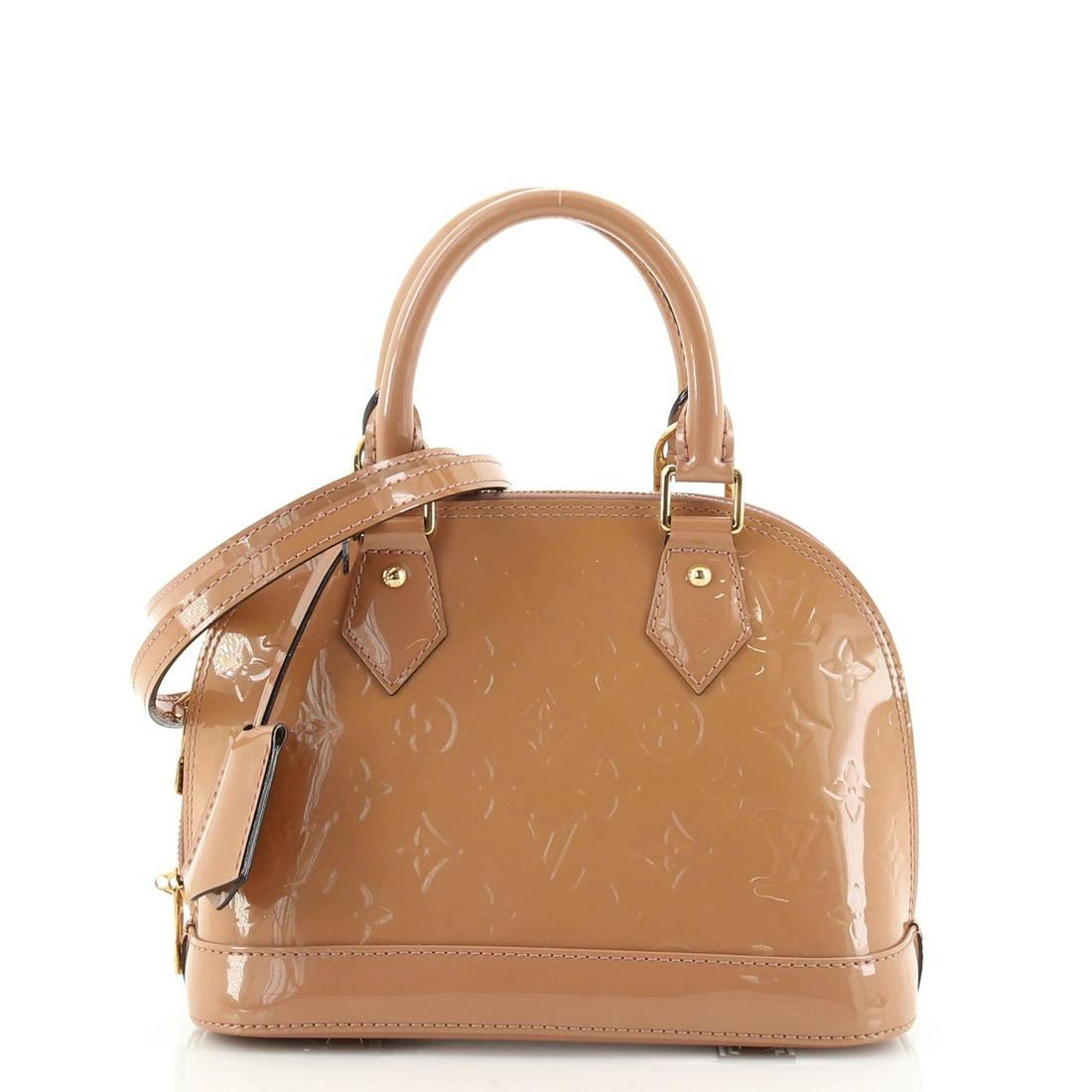 Alma Handbag Monogram Vernis BB Louis Vuitton: Alma Handbag Monogram Vernis BB Louis Vuitton Exterior Color: Neutral Interior Color: Neutral Exterior Material: Patent Leather Interior Material: Fabric Hardware Color: Gold Accessories: Clochett