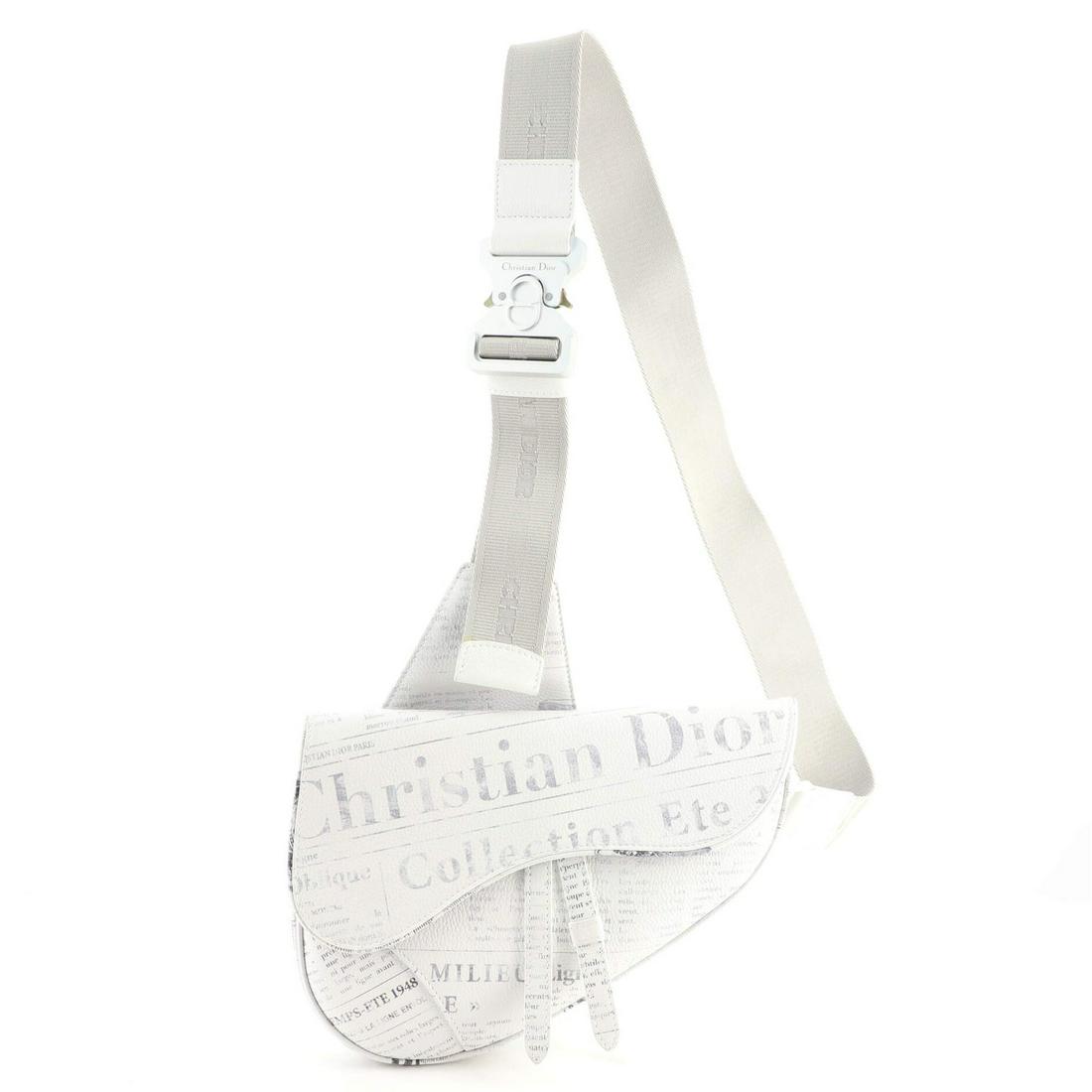 Christian Dior Daniel Arsham Saddle Crossbody Bag Printed Leather: Christian Dior Daniel Arsham Saddle Crossbody Bag Printed Leather Exterior Color: Print, White Interior Color: Blue Exterior Material: Leather Interior Material: Nylon Hardware Color: Silver Acces