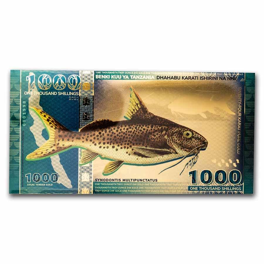 2021 Tanzania 1/1000 oz Gold Catfish Foil Note (w/COA & Sleeve): 2021 Tanzania 1/1000 oz Gold Catfish Foil Note (w/COA & Sleeve) Product ID: 237037 Year: 2021 Grade: (U) Gem Unc Grade Service: None Denomination: 1000 Shillings Mint Mark: N/A - Not Available