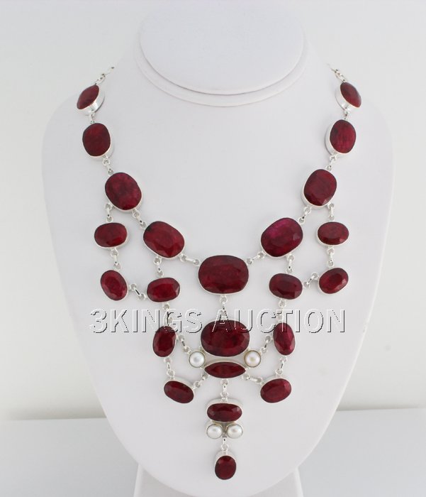 Lovely 533.50ctw Ruby Beryl Sterling Silver Necklace: Lovely 533.50ctw Ruby Beryl Sterling Silver Necklace **|**|** Heavy Cut Mix Sizes Ruby Gemstone with Pearls Handcrafted Silver Necklace size: 16 inches; color: Red; Family Stone: Beryl ; MSRP: $800