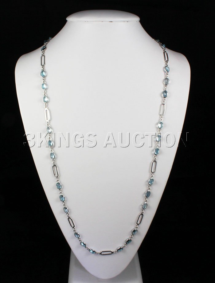 118.92CTW Blue Zircon in Figaro Box Silver Chain: 118.92CTW Blue Zircon in Figaro Box Silver Chain **|**|** 32 inches long strand Silver Figaro Box Chain with Oval Blue Zircon Gemstone; Size: 8x6mm; ctw: 72.00; stone count: 36; gram weight: 9.38 ; MS
