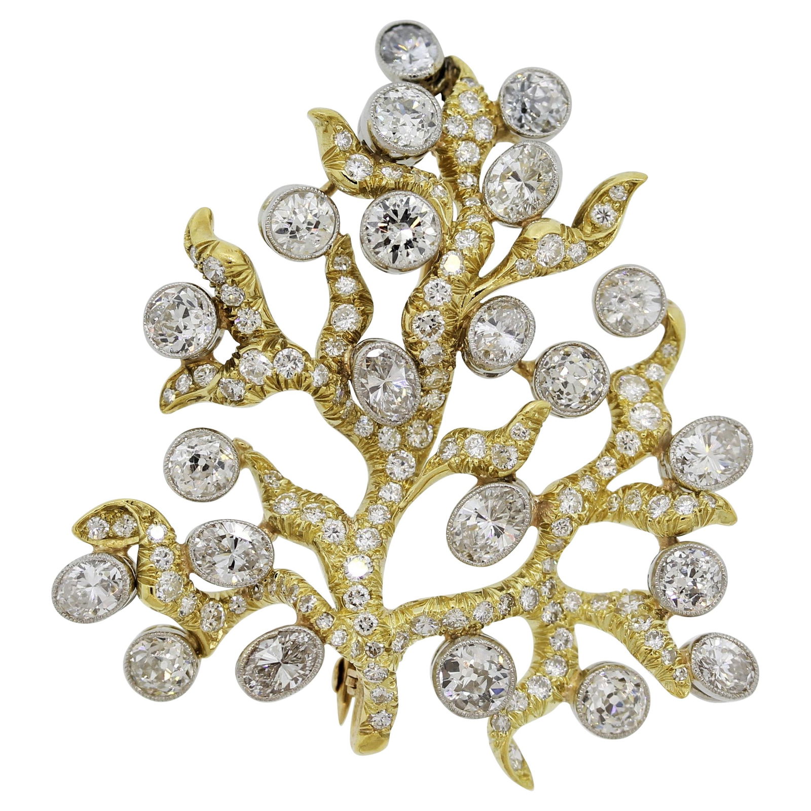 Julius Cohen Diamond Gold Tree-of-Life Brooch: Julius Cohen Diamond Gold Tree-of-Life Brooch Metal: White Gold, Gold, 18k Gold, Yellow Gold Stone: Diamond Stone Cut: Mixed Cut Dimensions: Length: 1.75 in (44.45 mm) Place of Origin: United States <