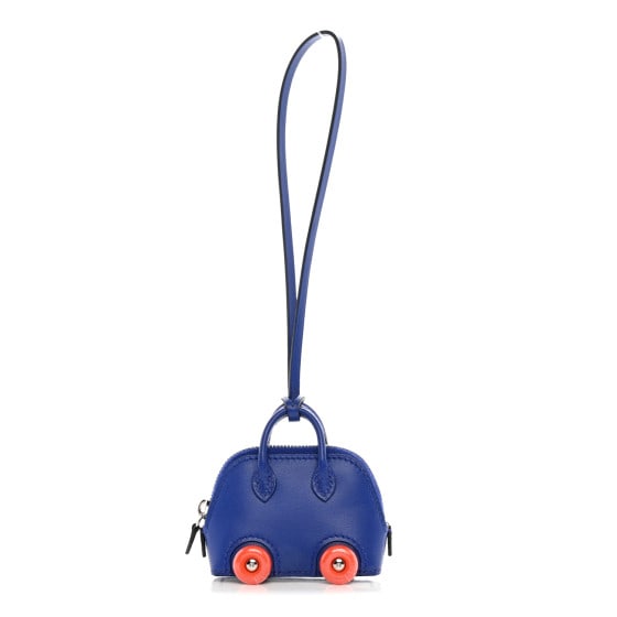 Hermes Chevre Mysore Bolide On Wheels Bag Charm Blue Electrique: Hermes Chevre Mysore Bolide On Wheels Bag Charm Blue Electrique This is an authentic HERMES Chevre Mysore Bolide On Wheels Bag Charm in Blue Electrique. This stylish Bolide handbag charm is crafted in