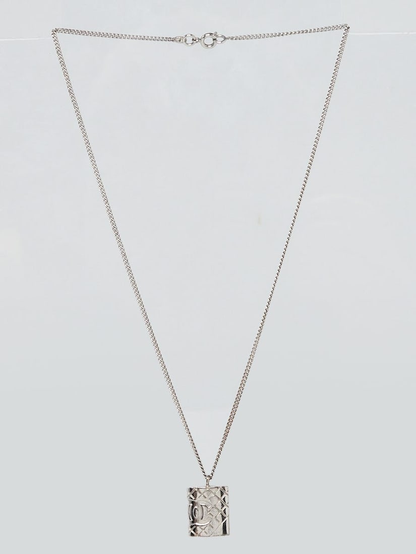 Chanel Silvertone Metal Cambon CC: Chanel Silvertone Metal Cambon CC Necklace Overall Condition: Gently used Designer: Chanel Material: Silvertone metal Includes: None Measurements: 1.25" L x .75" H Closure/Opening: Spring ring cla