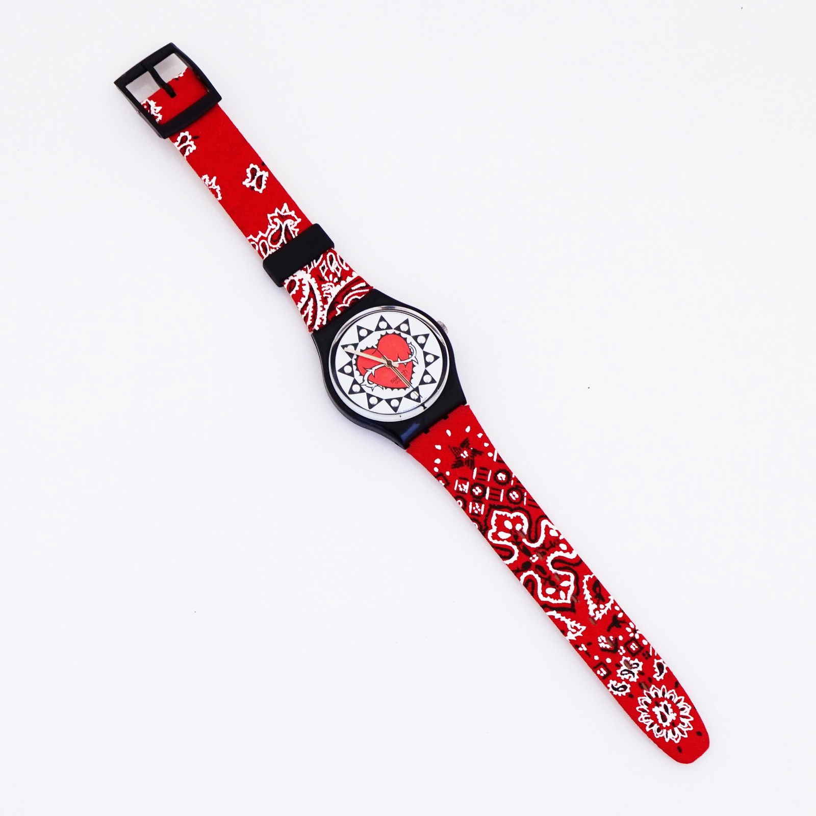 Red Bandana "Trash" Wristwatch With: Red Bandana "Trash" Wristwatch With Heart Face and Leather Band By Swatch, 1990s Brand: Swatch Movement: Quartz Style: Modern Place of Origin: Unknown Period: 1990-1999 Date of Manufacture: 1990s