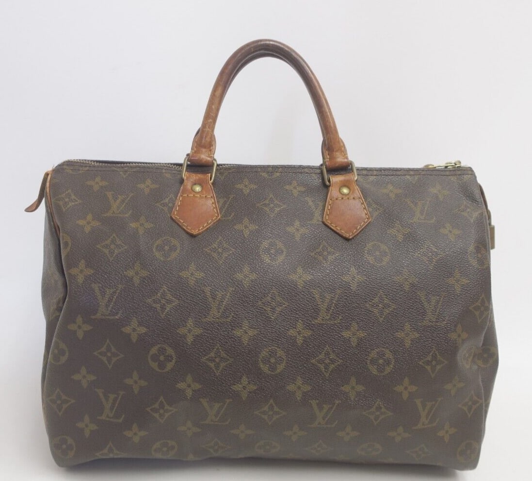 Authentic Louis Vuitton Speedy 35 Handbag: Authentic Louis Vuitton Speedy 35 Handbag Monogram Brown #35679 Condition: Pre-owned Brand: Louis Vuitton Department: Women Exterior Color: Brown Style: Handbag Country/Region of Manufacture: Fran