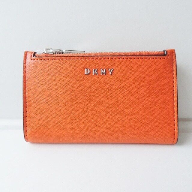Auth DKNY Orange Beige Leather Bifold: Auth DKNY Orange Beige Leather Bifold Wallet Condition: Pre-owned Brand: DKNY Style: Bifold Wallet Color: Orange, Beige Material: Leather ConditionRank: 7 Department: Women Type: