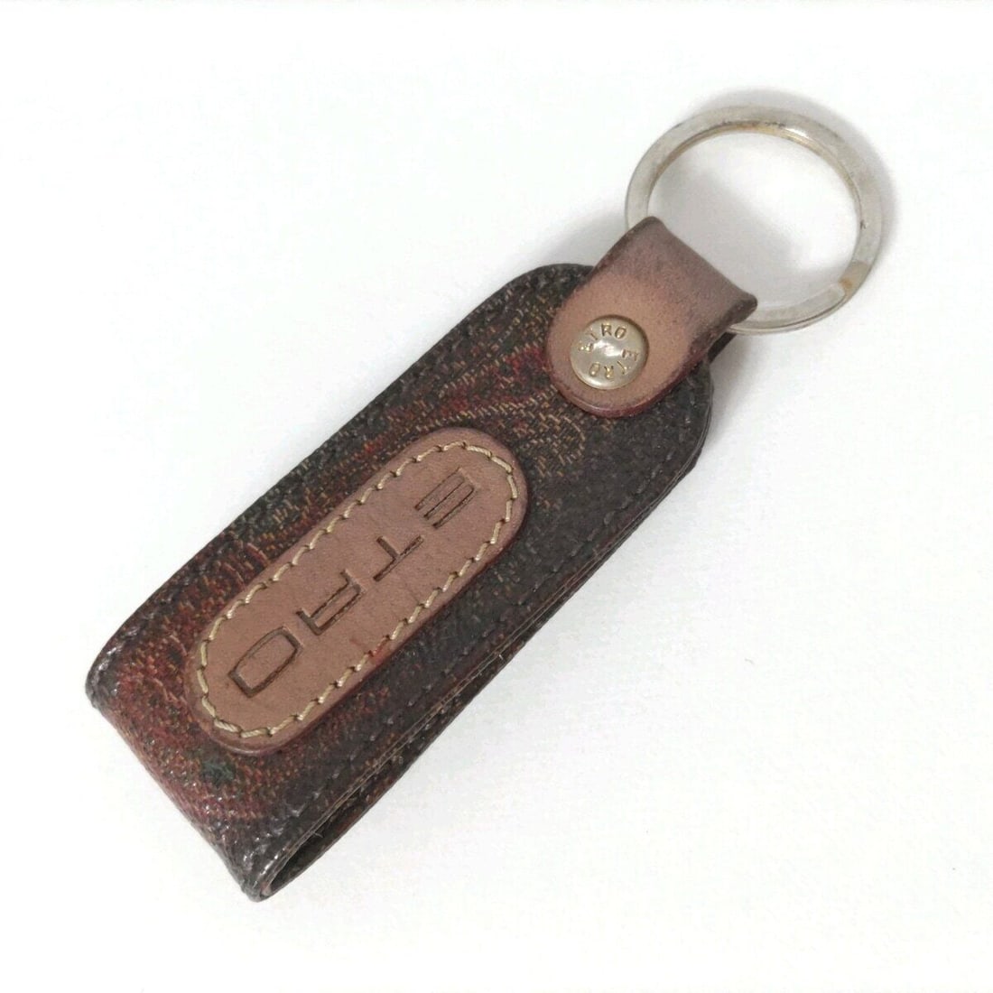 Auth ETRO - Dark Brown Silver: Auth ETRO - Dark Brown Silver Multi PVC Hardware Bag Charm Condition: Pre-owned Brand: ETRO Style: Bag Charm Color: Dark Brown, Silver, Multi Material: PVC, Hardware ConditionRank: 6 Type