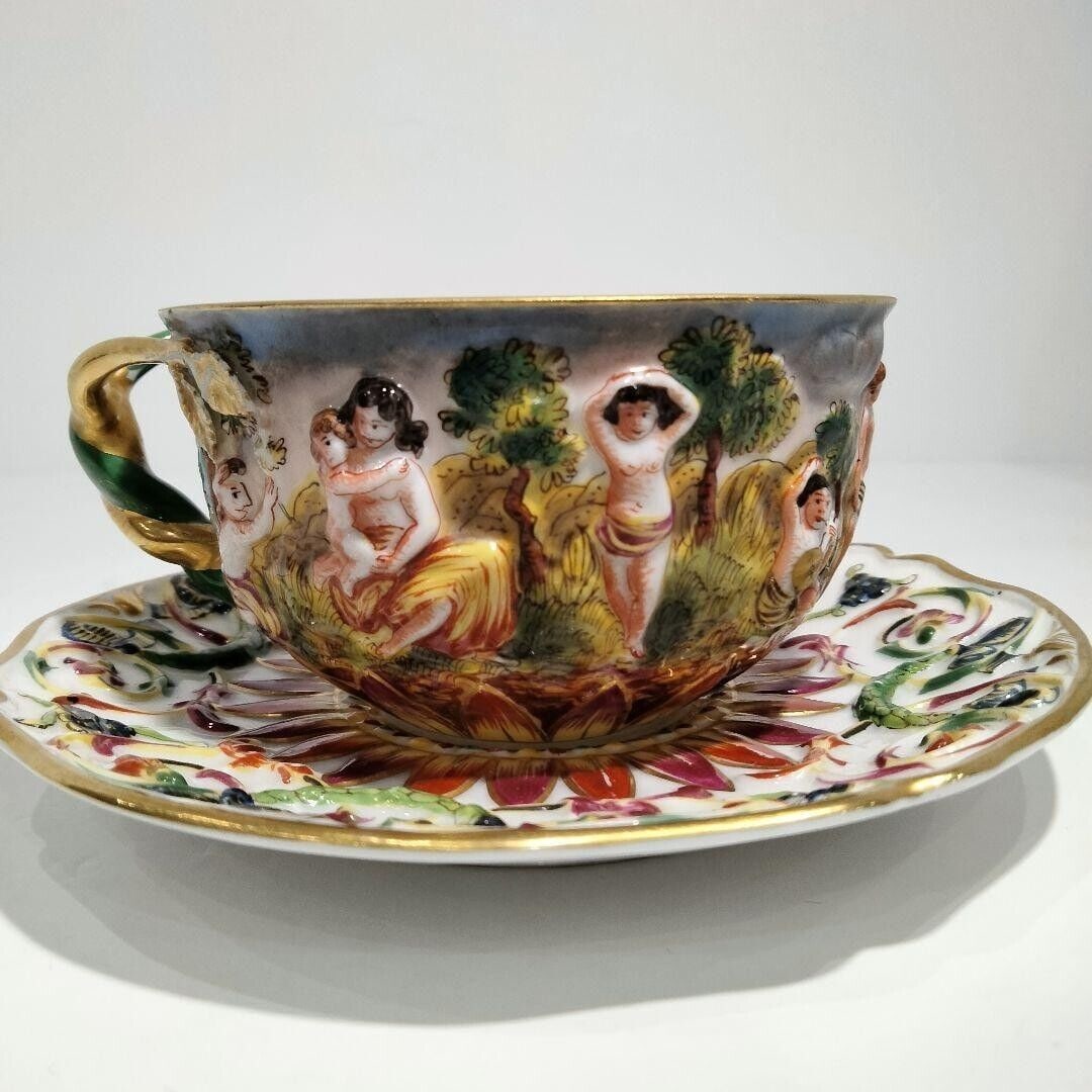 Capodimonte Cup Saucer Relief Figure 1900: Capodimonte Cup Saucer Relief Figure 1900 Early T Used Condition: Used Brand: Richard Ginori Type: NA Theme: NA Time Period Manufactured: NA Country/Region of Manufacture: NA Production T