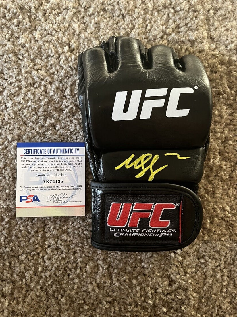 khamzat chimaev autographed signed ufc glove: khamzat chimaev autographed signed ufc glove PSA witness COA This is a rare opportunity to own an autographed UFC glove by Khamzat Chimaev, a rising star in mixed martial arts. The glove has been auth