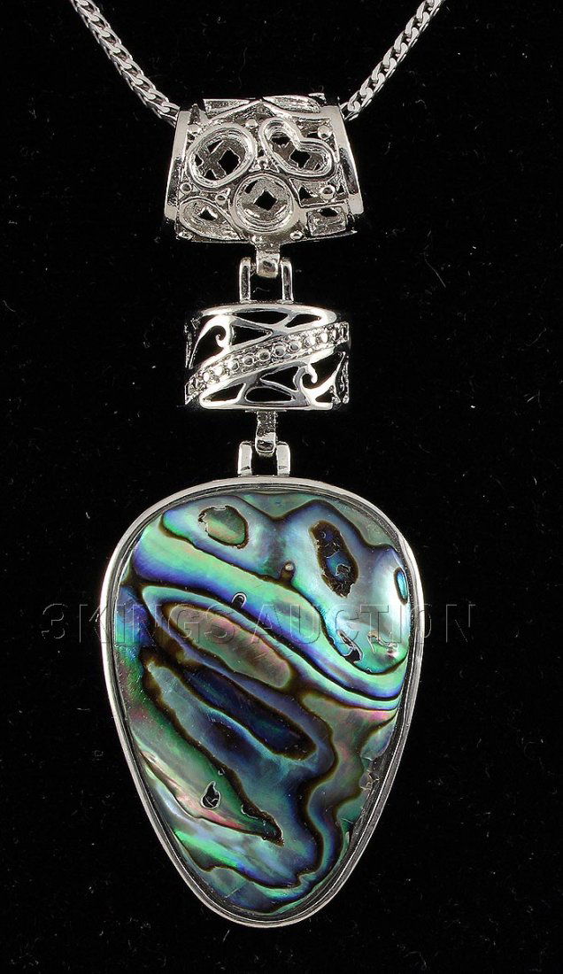 NATURAL 14.44GRAMS MOTHER OF PEARL SILVER PENDANT: NATURAL 14.44GRAMS MOTHER OF PEARL SILVER PENDANT **|**|** 1.50X1.08 INCHES PEAR SHAPE MOONSTONE RAINBOW COLOR MOTHER OF PEARL SILVER PENDANT ; MSRP: $300