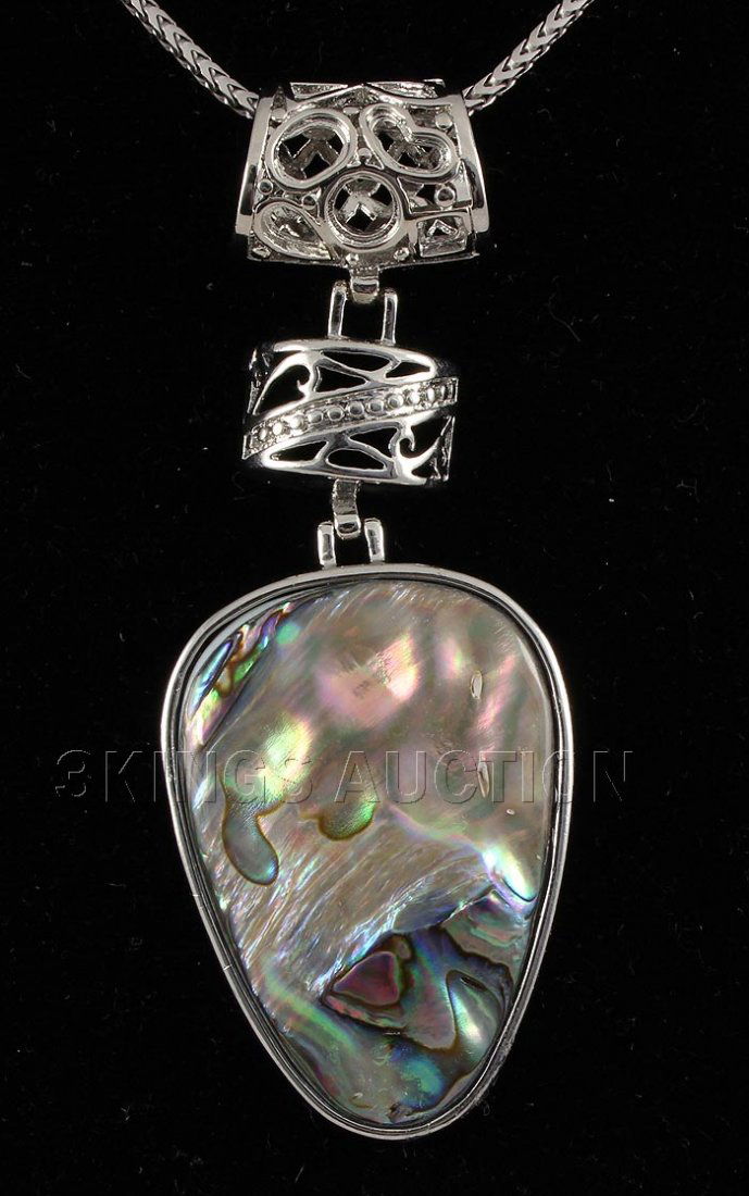 NATURAL 15.03GRAMS MOTHER OF PEARL SILVER PENDANT: NATURAL 15.03GRAMS MOTHER OF PEARL SILVER PENDANT **|**|** 1.50X1.08 INCHES PEAR SHAPE MOONSTONE RAINBOW COLOR MOTHER OF PEARL SILVER PENDANT ; MSRP: $300