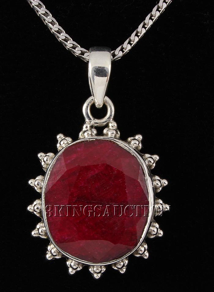 RUBY CORRUNDUM 36.42CTW STERLING SILVER PENDANT: RUBY CORRUNDUM 36.42CTW STERLING SILVER PENDANT **|**|** 19X17MM OVAL SHAPE RUBY CORRUNDUM FLOWER DESIGN SILVER PENDANT ; MSRP: $400