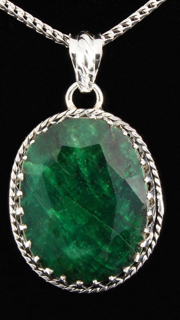 NATURAL EMERALD BERYL 61.54CTW SILVER PENDANT: NATURAL EMERALD BERYL 61.54CTW SILVER PENDANT **|**|** STERLING SILVER OVAL PENDANT WITH 25X19MM APPROX EMERALD BERYL GEMSTONE ; MSRP: $200