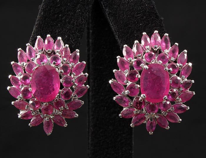 15.52ctw Pink Ruby Cluster Sterling Silver Earring 7.65: 15.52ctw Pink Ruby Cluster Sterling Silver Earring 7.65g **|**|** Natural Ruby Corrundum Gemstone 1pc Oval 9x7mm, 11pcs Round 3mm & 20pcs MQ 5x2.5mm in Silver Earring; Size: 1.05x0.85 inches ; MSRP: $
